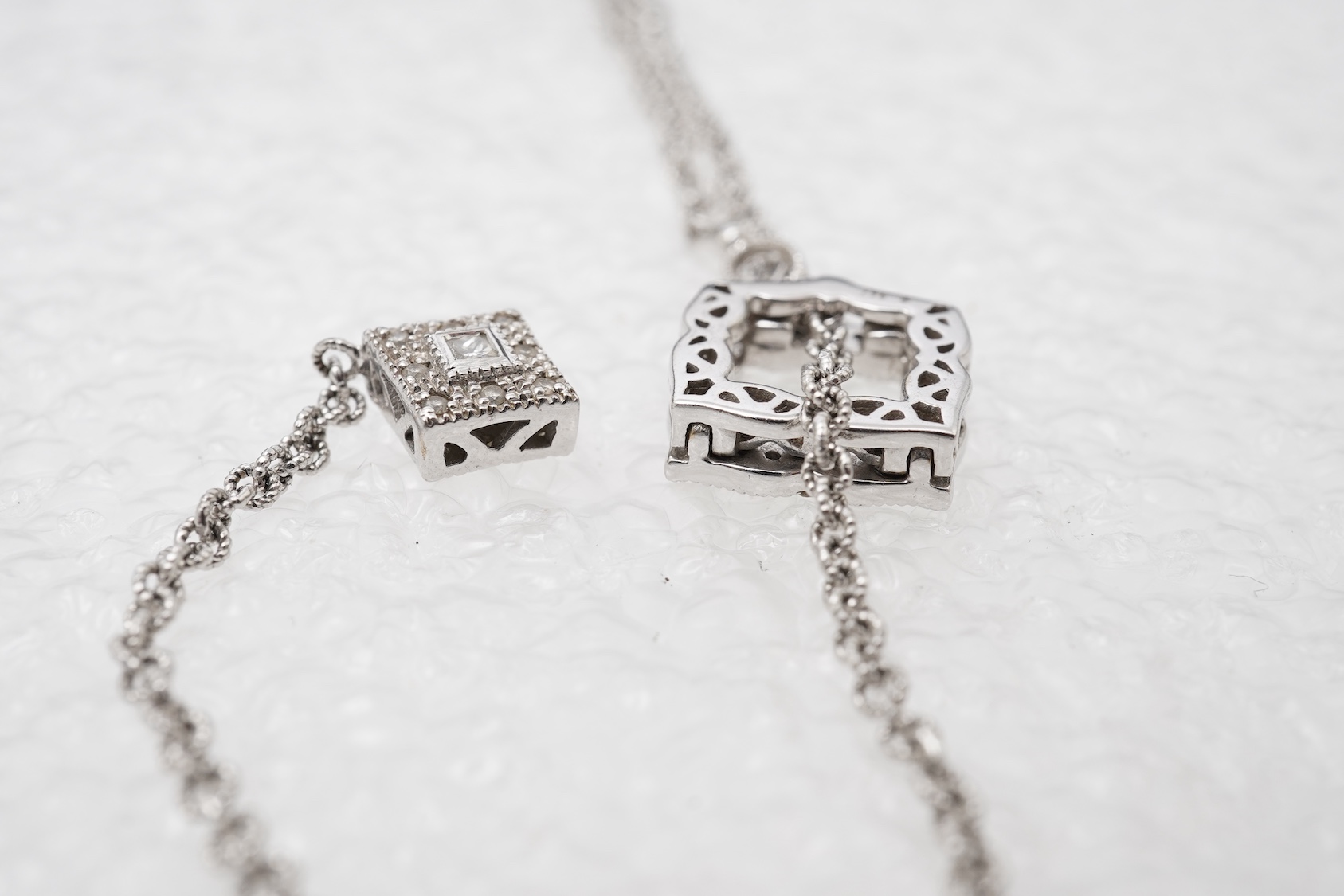 A diamond lariat necklace